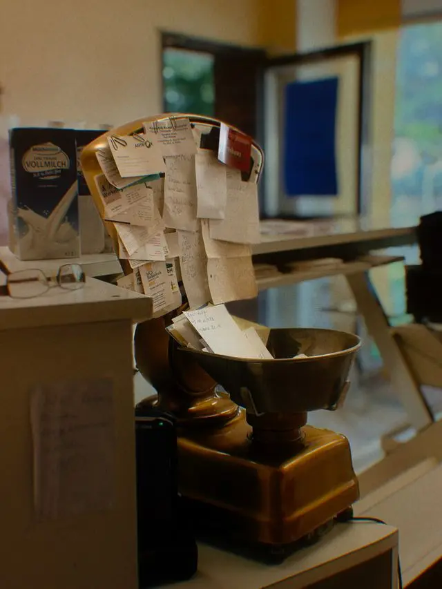 A scattered handful of faded crumpled paper receipts